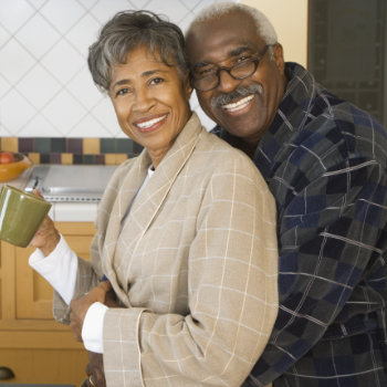 Senior African couple hugging