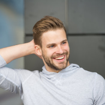confident young man laughing