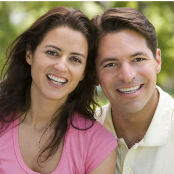 hispanic Couple Outdoors Smiling