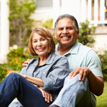 hispanic Senior couple relaxing in garden