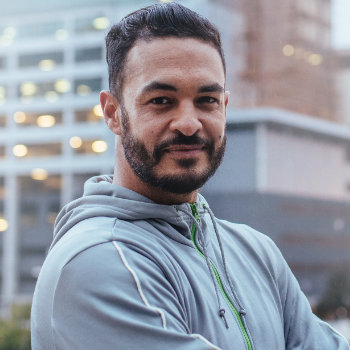 mature confident hispanic man in hoodie